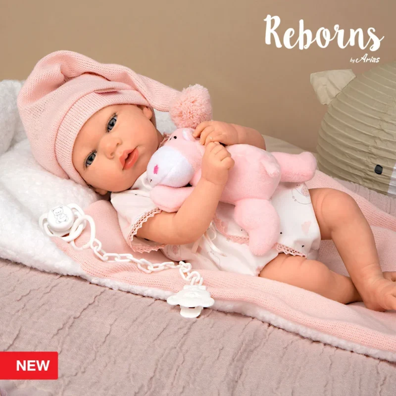 e5546d3e60a48e2c126b8894357b2736.large Reborn Arias 40 cm Ariel rosa com almofada e pelúcia